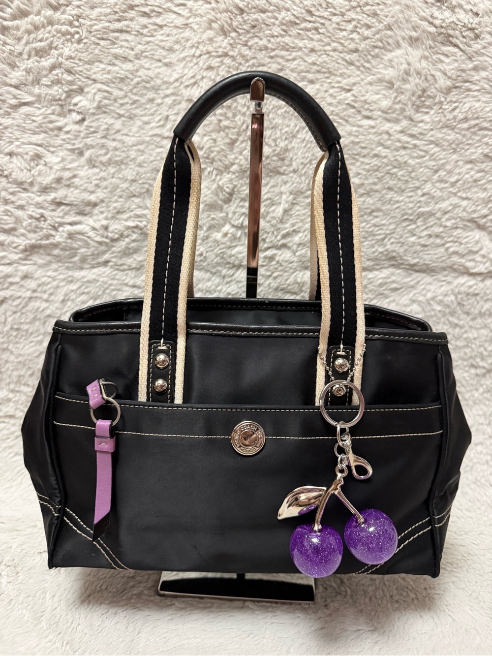 Coach Hamptons Black Shoulder Tote with Cream-Trim Handles & Purple Cherry Charm